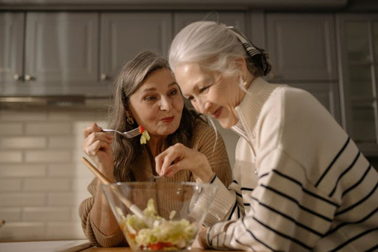 senior women eating high protein salad